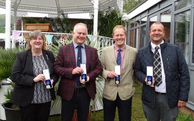 Four staff members clock up 120 years of service
