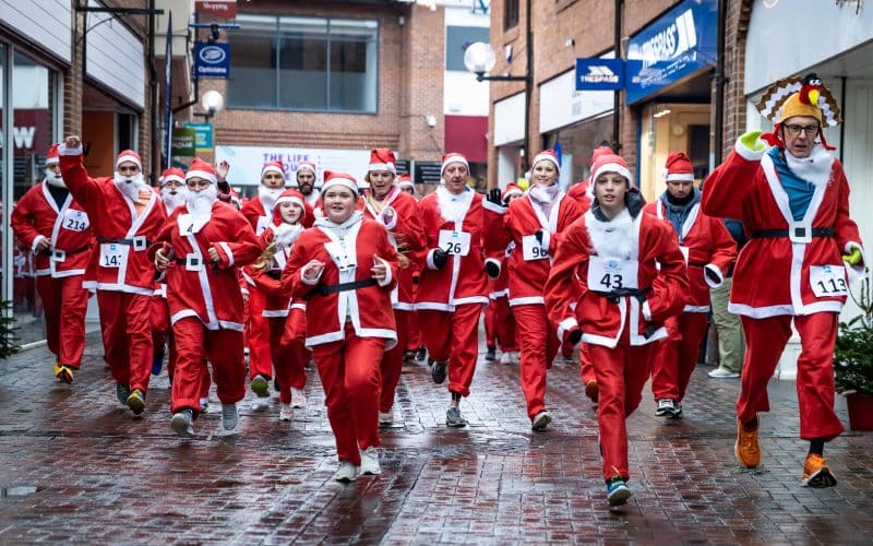 A huge number of Santas turned heads during a festive family run through Hereford